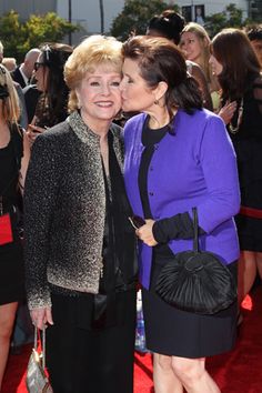 LOS ANGELES, CA - SEPTEMBER 10:  Debbie Reynolds (L) and Carrie Fisher attend the 2011 Primetime Creative Arts Emmy Awards at Nokia Theatre on September 10, 2011 in Los Angeles, California.  (Photo by Noel Vasquez/Getty Images)