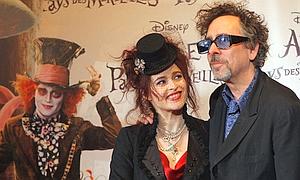 U.S. director Tim Burton, right, and his companion British actress Helena Bonham Carter pose before the French Premiere of the movie Alice in Wonderland, in Paris, Monday March 15, 2010. (AP Photo/Christophe Ena)